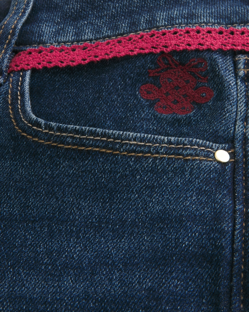 låg midja djupt tvättade broderade bootcut-jeans